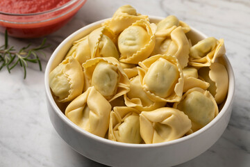Bowl with traditional fresh Italian tortellini stuffed with Ricotta and Spinach close up 
