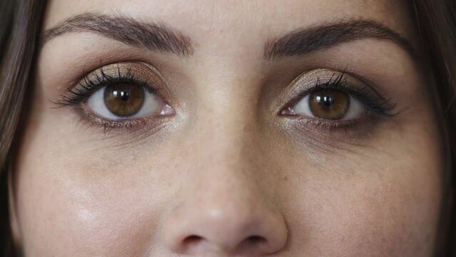 Vision test and eyes on face of woman for optometrist contact lenses assessment of eyesight zoom. Health, wellness and optometry eye exam of girl with blink for sight analysis and evaluation.