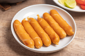 Sausages on a white plate for breakfast