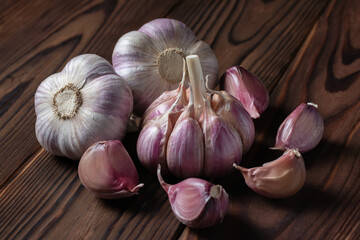 Garlic bulb on wooden background. Close up