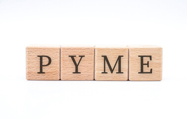 word " pyme " written in wooden blocks on white background
