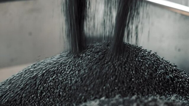 Raw Material For Production Of Rubber Products. Rubber Granules With His Hand