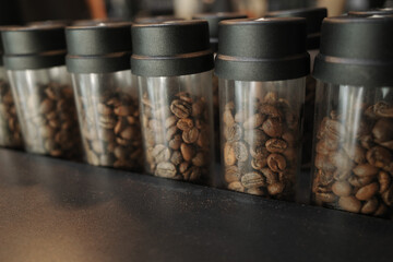 Close up variety of coffee beans in tube of glass, choice for costumer 