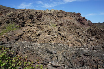 Volcanic landscapes of Lanzarote. Solidified lava, lava chimney, lava tunnel, sea of lava, eruption, canary islands, crater, volcano, black rocks, photographed in November 2022, trekking trip,