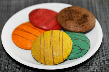 Gingerbread in different colours on a plate