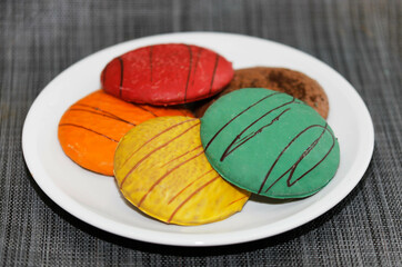 Gingerbread in different colours on a plate