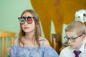 A girl in special glasses for the treatment of vision problems.