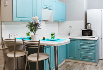 the interior of a modern kitchen in a hotel room with a countertop and kitchen appliances