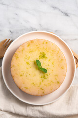 Delicious Lemon Glazed Pound Sponge cake on white marble table background.