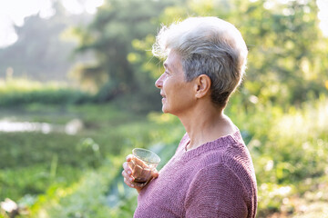 Family aunty mom on holiday travel drink morning coffee enjoy look green nature view relaxation
