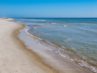 Calm blue sky summer  day on the Gulf of Mexico beach on St George Island in the panhandle or Forgotten Coast area of Florida in the United States
