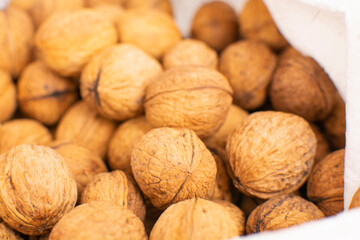 Walnuts with shells. Background of fresh walnuts.