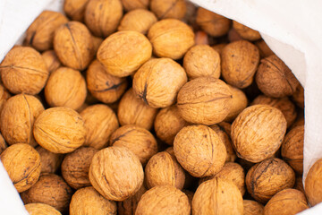 Walnuts with shells. Background of fresh walnuts.