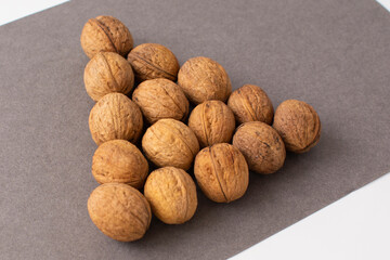 The shape of the Christmas tree of their fresh walnuts. New Year