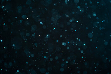 Abstract real dust particles on black background. Glittering sparkling bokeh overlay design with...