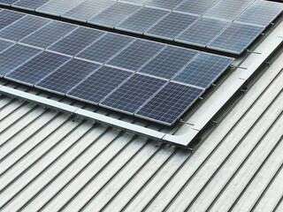 solar energy over a photovoltaic power plant, solar panels on a roof , green clean energy concept.	