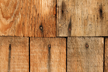 Wood planks with screws and nails texture. Wooden boards background. Vertical direction.
