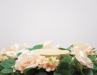 empty wooden podium beige rose bouquet flowers decoration on white background with space.beauty...