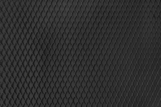 Steel black protective grille with mesh background texture and pattern. Industrial corrugated rough iron surface