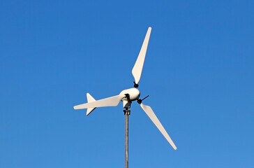 A small-scale wind turbine. Concept of sustainability and green energy