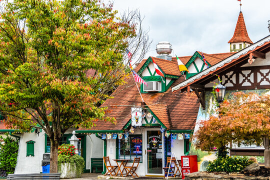 Helen, USA - October 5, 2021: Helen, Georgia Bavarian town with sign on building for Village Crepe Haus restaurant at Oktoberfest festival with traditional architecture