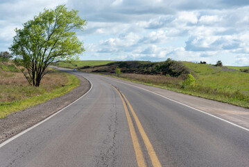 Fototapeta na wymiar Highway cutting through rural landscape