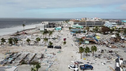 As day breaks on September 29, 2022, the damage from Hurricane Ian is seen for the first time on Fort Myers Beach, FL.