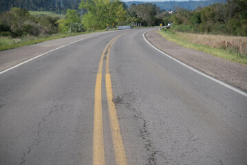 Highway cutting through rural landscape