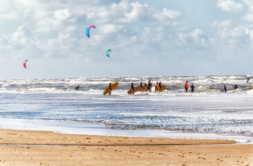 Surfers getting surf classes on the beach