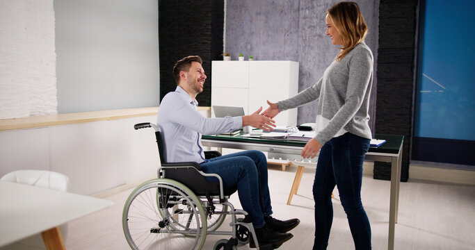 Business Person In Wheel Chair Shaking