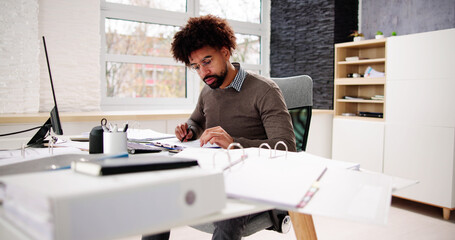 Portrait Of A Accountant Man Calculating