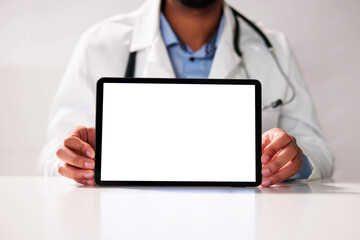 Young Happy African Doctor Working On Computer