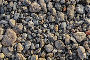Wet gravel on the side of the road