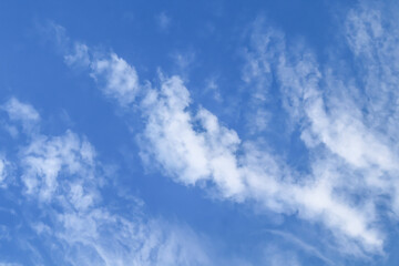 Thunderclouds against the blue sky. Template for wallpaper, stretch ceilings