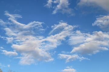 Thunderclouds against the blue sky. Template for wallpaper, stretch ceilings