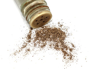 Black allspice ground pepper on a white background.