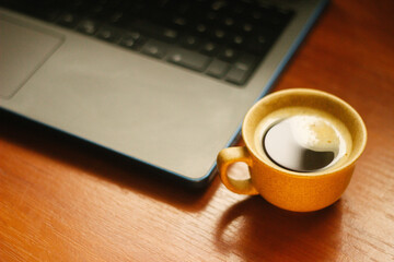 Obraz na płótnie Canvas coffee mug on the table, Bokeh effect