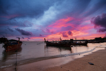 Beautiful landscape with traditional longtail boat on the beach. Phuket, Thailand.