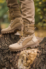 Leather waterproof boots on military. Demi-season high boots of khaki color