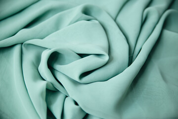 Turquoise knitted fabric. Sewing material .