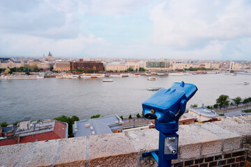 Fototapeta na wymiar Coin Operated Binocular viewer in Budapest looking out to the river and city.