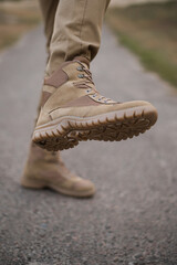 A soldier shod in special tactical khaki shoes
