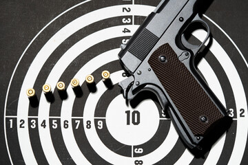 Gun and many bullets shooting targets. Training for aiming and shooting accuracy