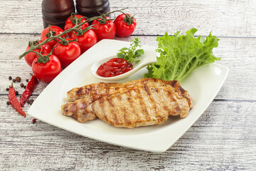 Grilled pork steak with ketchup