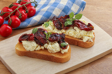 Bruschetta with soft cheese and tomato