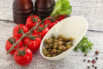 Marinated green capers in the bowl