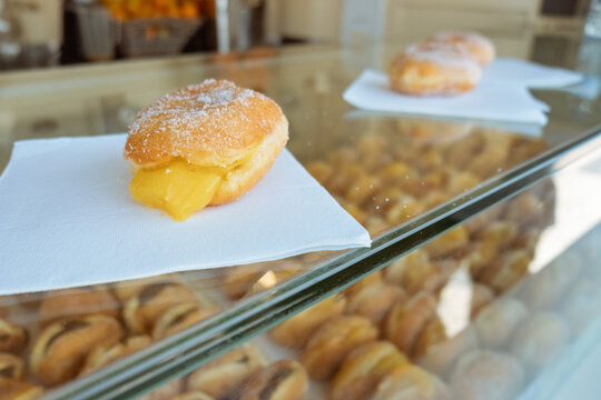 Bread with cream, known as berlin ball, donut without a hole or bakery dream. Typical sweet dob rasil, portugal and germany. Street food