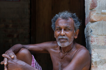 Portrait of rural man sitting at home