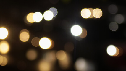 Blurred defocused image of evening car traffic in a big city. Cars in motion and standing in traffic jams. Long exposure exposure and headlight trails