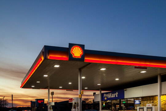Irving, Texas, USA - March 20, 2022: A Shell gas station at dusk.  Shell Oil Company is an affiliate of the Royal Dutch Shell plc, a global group of energy and petrochemical companies. 